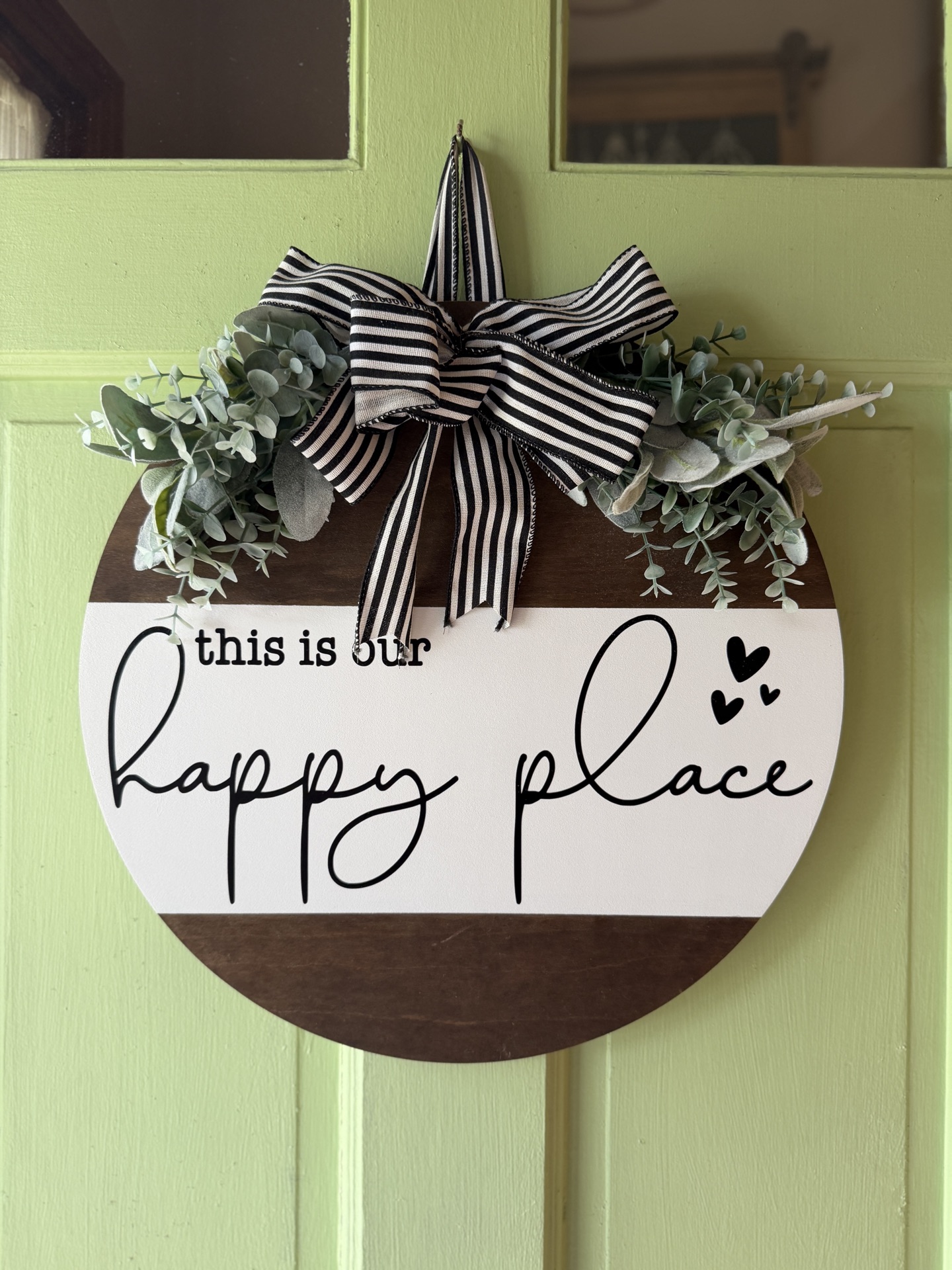 Welcoming entrance with 'this is our happy place' sign
